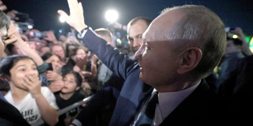 Russian president Vladimir Puting waves to supporters.