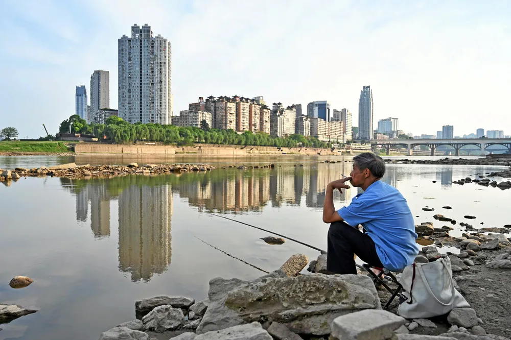 Patience: a man fishing in the Tuo River in south-east Sichuan Province