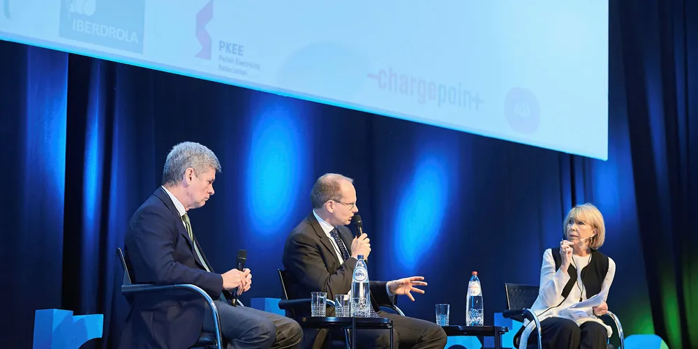 Antonio Espinosa of Iberdrola Distribution (left) and Hakan Agenval of Volvo Buses (centre) are interviewed at the Eurelectric event by journalist and presenter Cathy Smith.
