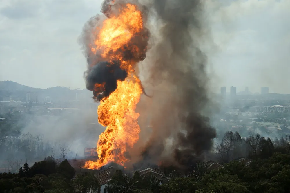 Flames and smoke rise after a gas pipeline operated by Malaysia's national energy company Petronas caught fire, in Puchong, Malaysia, on 1 April 2025.
