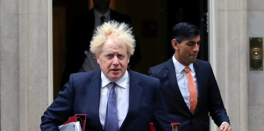British Prime Minister Boris Johnson and Chancellor of the Exchequer Rishi Sunak (rear).
