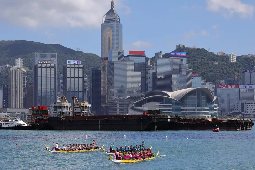 Teams compete during the International Dragon Boat races at Tsim Sha Tsui East Promenade in Hong Kong on June 7, 2025.