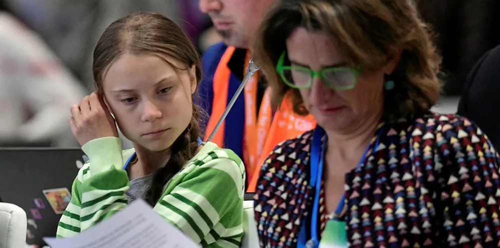 Swedish climate activist Greta Thunberg and Spanish minister of energy and climate change Teresa Ribera during the UN Climate Change Conference COP25.