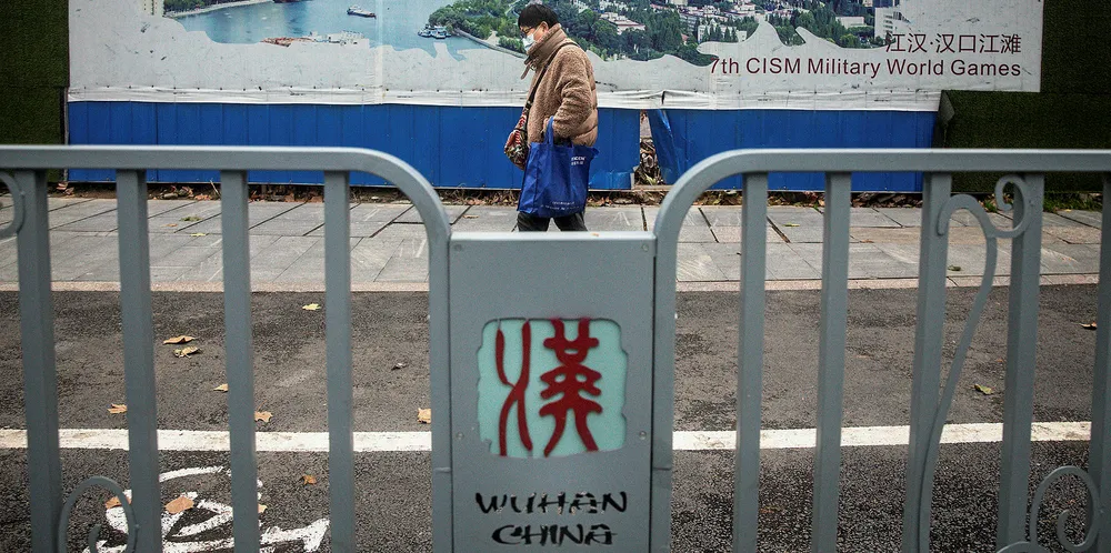 A woman walks on an empty road on January 27, 2020 in Wuhan, China. Yang Jun had visited the city earlier in the month.