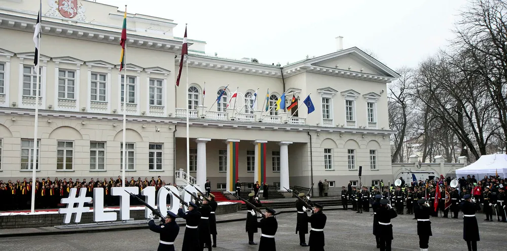 Lithuanian troops parade during a ceremony marking 100 years since Lithuania regained independence after World War I.