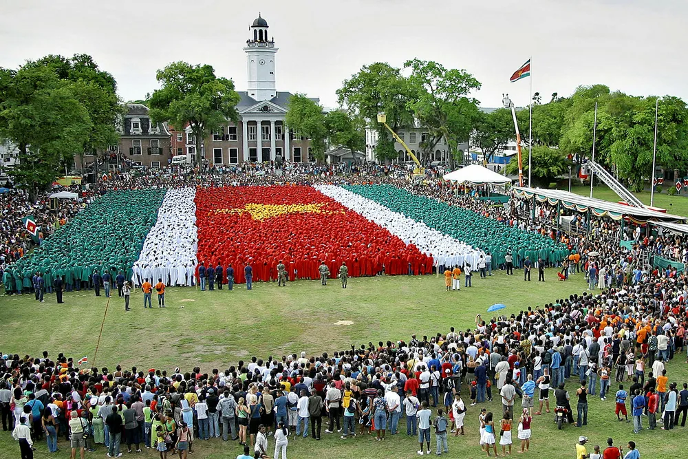 National pride: Surinamese students form the national flag at the Independence Square in Paramaribo, Suriname