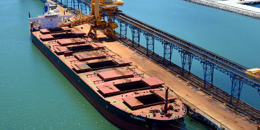 A capesize bulk carrier being loaded with iron ore at Porto Sudeste, Brazil. Capesize rates have risen significantly this past week.