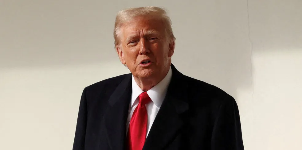 President Donald Trump talks to reporters at the White House on Tuesday.