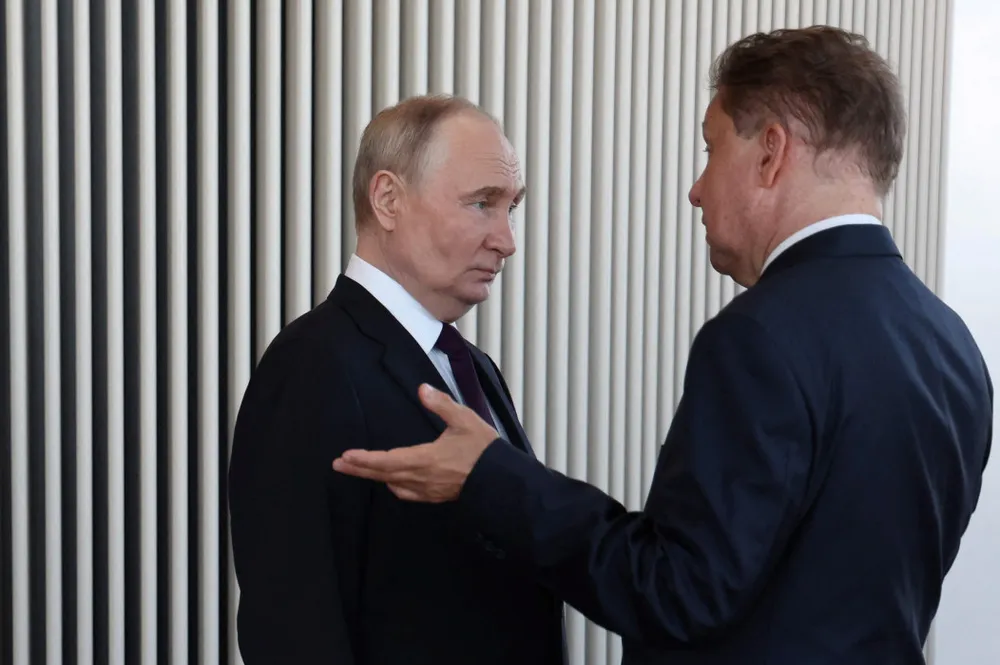 Russia’s President Vladimir Putin (left) speaks with Gazprom executive chairman Alexei Miller.