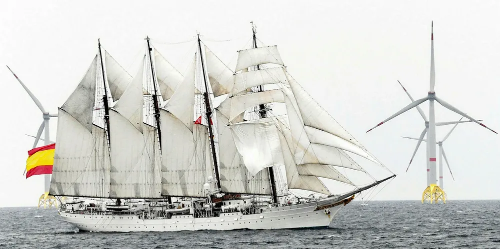 Sail ship in front of Wikinger - one of Germany's latest offshore wind farms