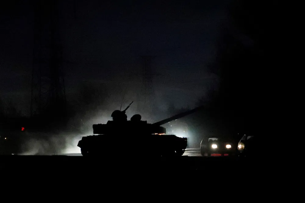 On the streets: a tank drives along a street in the separatist-controlled city of Donetsk in the east of Ukraine after Russian President Vladimir Putin ordered the deployment of Russian troops there and in the other self-proclaimed republic of Luhansk