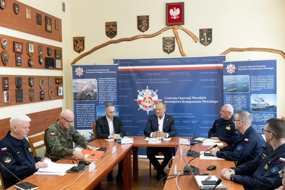 Polish Prime Minister Donald Tusk attends a briefing at the Maritime Operations Center - Maritime Component Command in Gdynia, Poland.