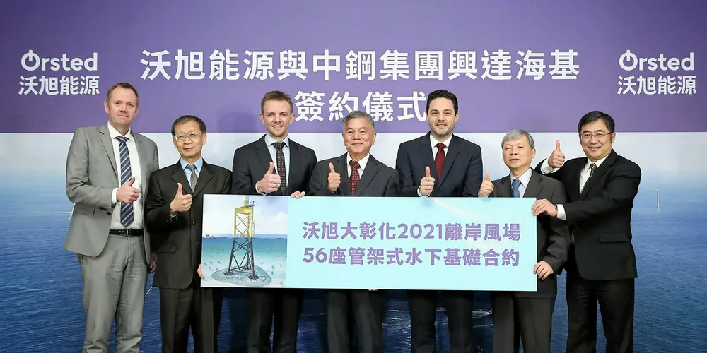 Executives from the two companies mark the contract award.