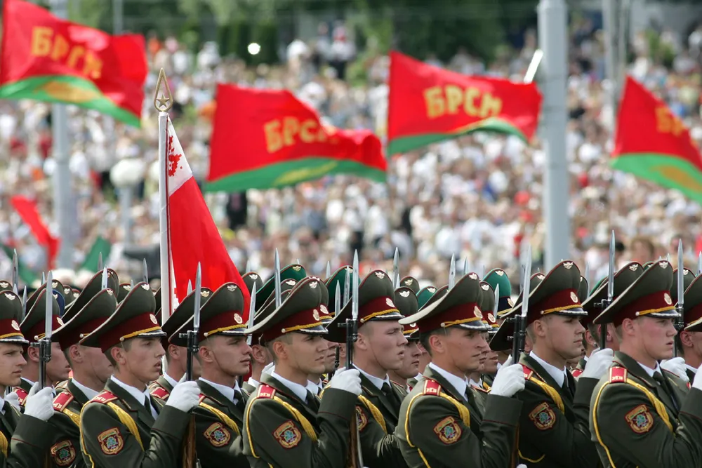 Minsk celebrates: an army honour guard marches as Belarus marks its liberation from Nazi occupation by the Red Army in 1944, but the country owes Russia another debt - Minsk still has not reached an agreement over its outstanding $500 million gas bill