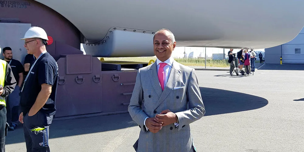 Siemens board member Michael Sen in front of a wind turbine