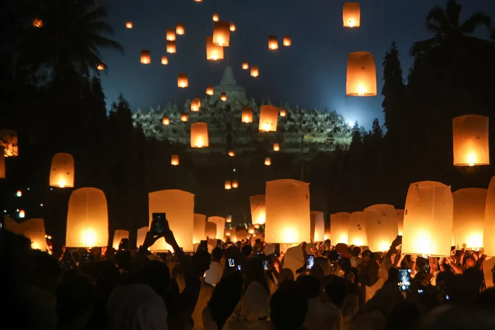Devotees fly lanterns to commemorate Vesak at the 9th Century Borobudur temple in Central Java, Indonesia, on 12 May 2025.