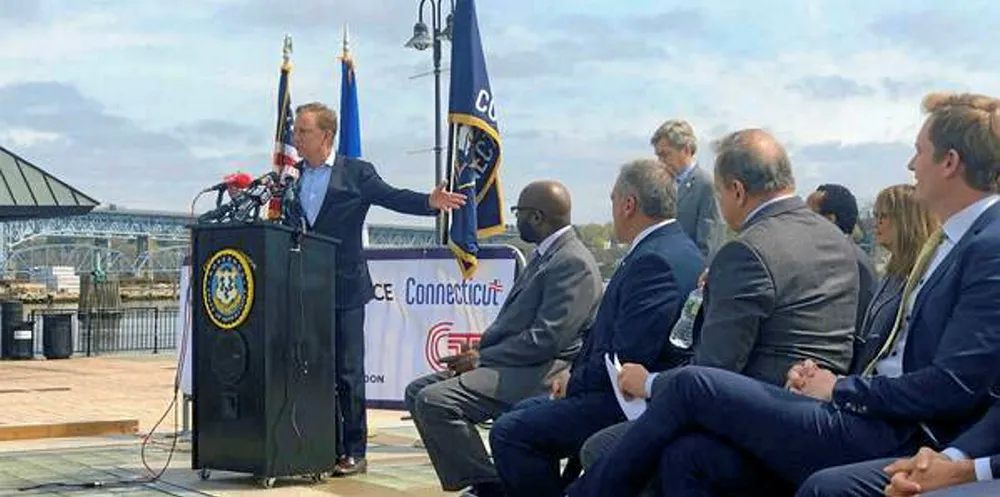 Governor Ned Lamont speaking at the Port of New London earlier this year.