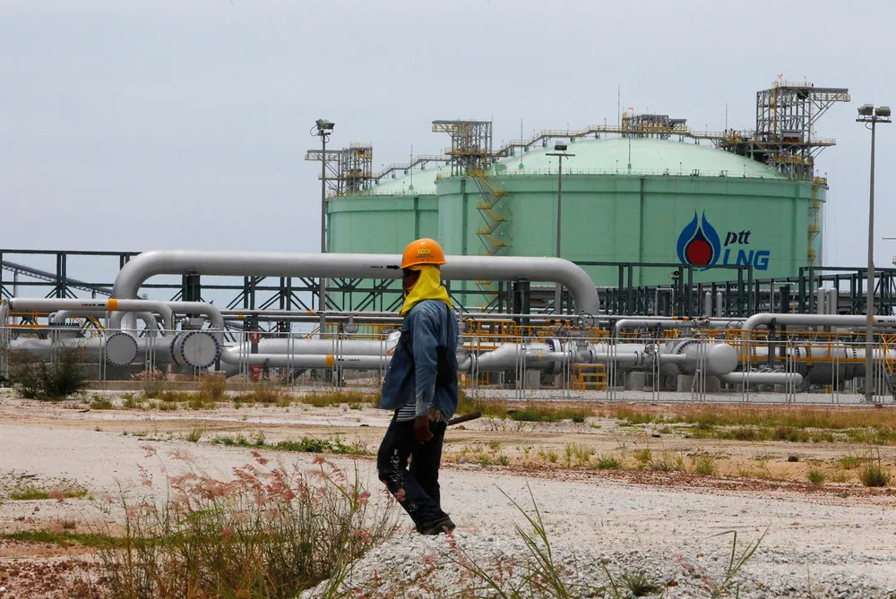 Flagship facility: an employee of national energy giant PTT outside the company's first liquefied natural gas import project at Map Ta Phut on Thailand's eastern seaboard.