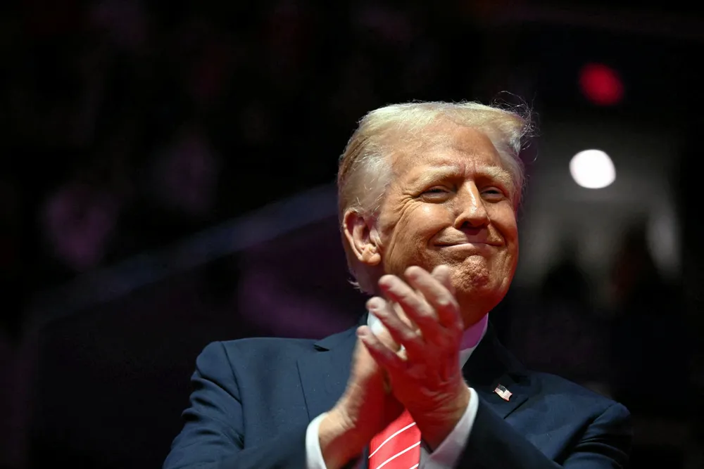 Donald Trump reacts during a MAGA victory rally at Capital One Arena in Washington, DC, on January 19, 2025, one day ahead of his inauguration ceremony.