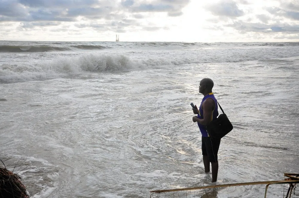 Surveying the scene: Ebiegberi Raynus, youth affairs coordinator at the Akassa Development Foundation and secretary general of the West African Sea Turtle Conservation, looks out to the jack-up Adriatic I that was leaking gas of Bayelsa State, Nigeria on 6 November