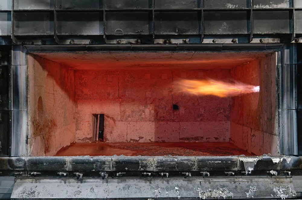 Hydrogen and oxygen flame burns in Constellium's aluminium smelting furnace.
