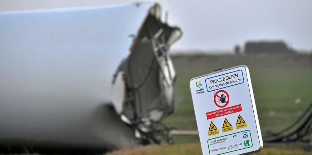Safety sign in front of a damaged wind turbine in Bouin, western France |