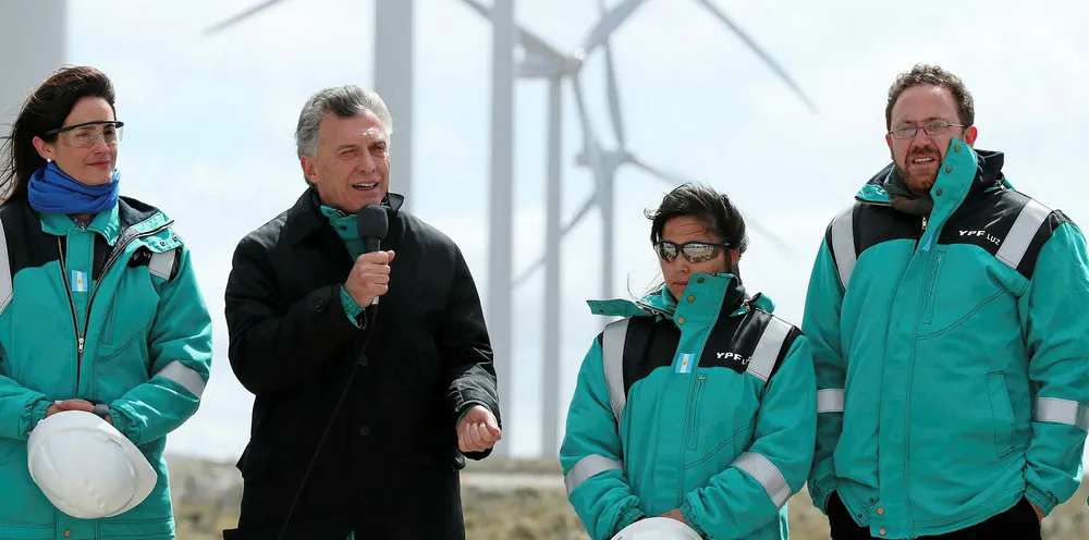 Business friendly Mauricio Macri, second left and visiting a wind farm, is under pressure in the polls.
