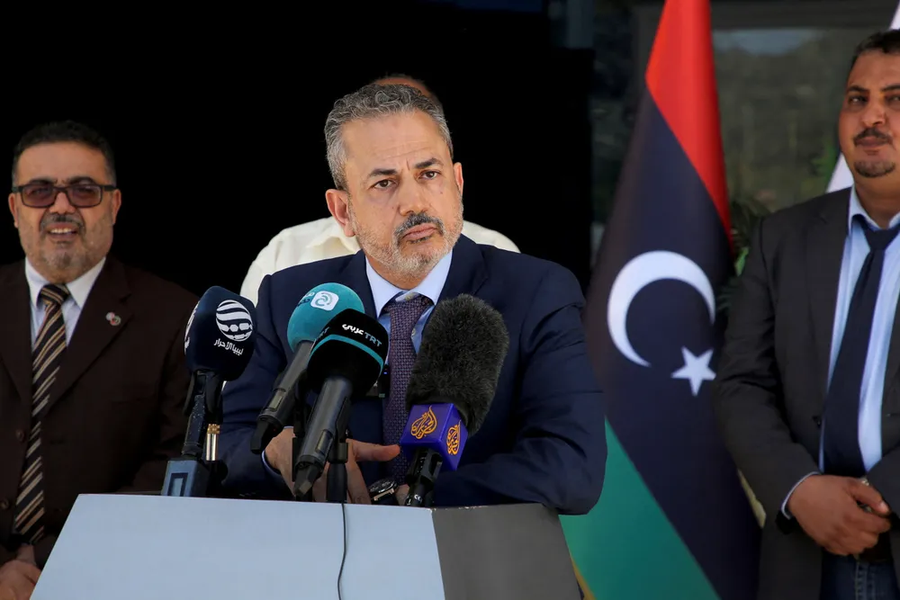 Appeal: Farhat Bengdara (centre), chairman of Libyan's National Oil Corporation, wants oil companies to lift force majeure