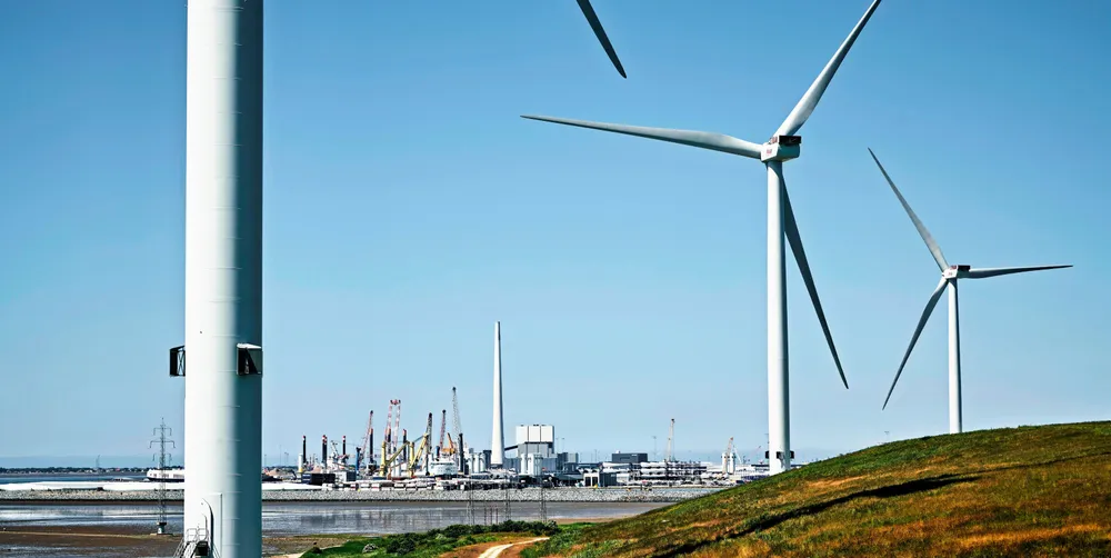 Wind turbines with port of Esbjerg in background.