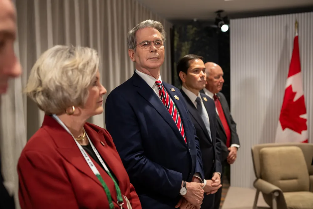 Treasury Secretary Scott Bessent (centre) stands with officials during a meeting between US President Donald Trump and Canadian Prime Minister Mark Carney in June.