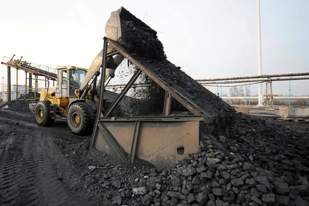 Rising production: heavy machinery moving coal at the yard of a mine in Huaibei in central China's Anhui province