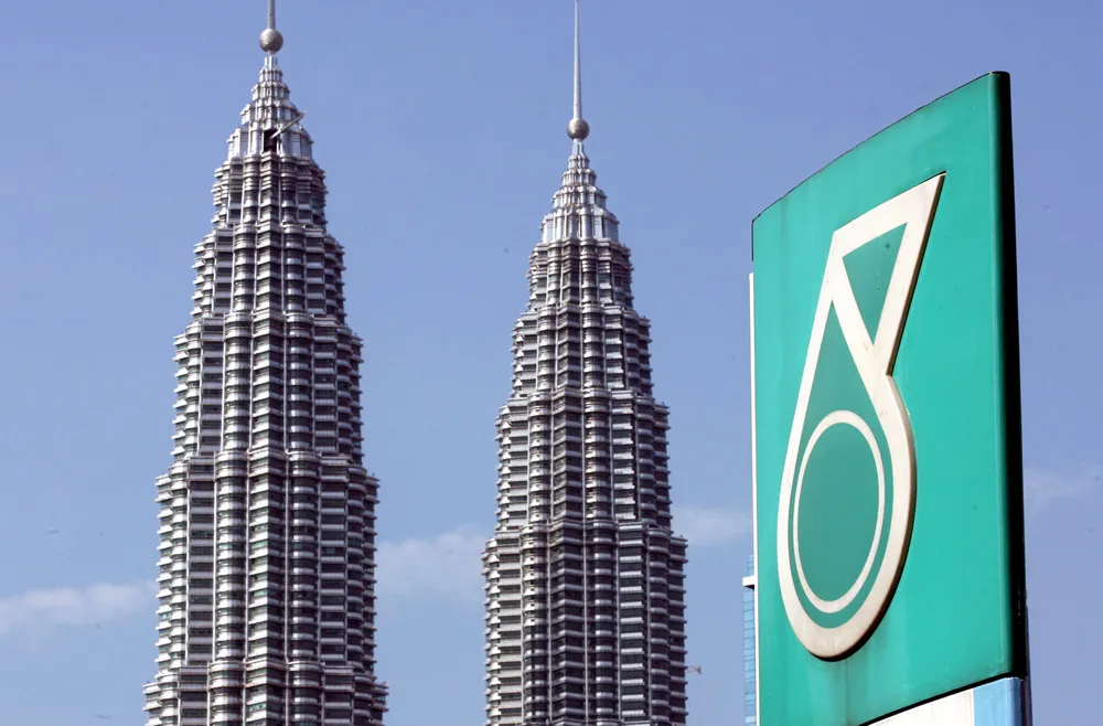 Helping hand: Petronas — from its flagship Kuala Lumpur headquarters — is boosting this year's government divided to 25 billion ringgit (US$5.97 billion)