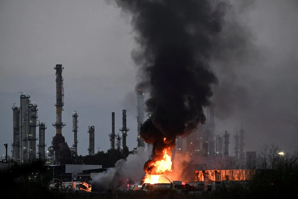 Smoke and fire rise at an impacted facility site following missile attack from Iran on Israel, at Haifa, Israel on 15 June 2025.