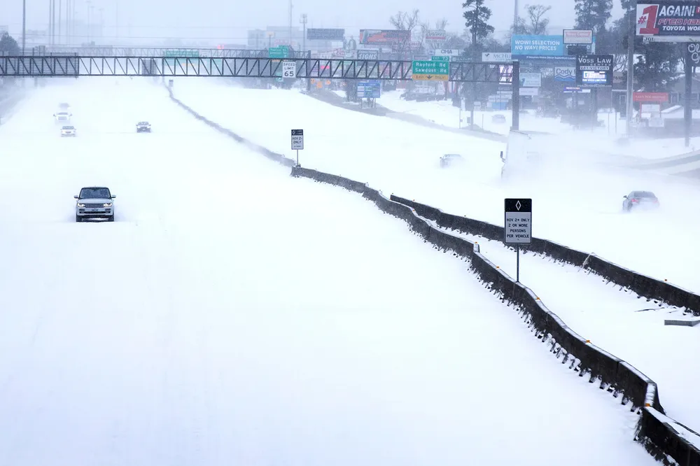 Frozen Texas: traffic is sparse on snow-covered Interstate 45 near Houston, Texas during Winter Storm Uri