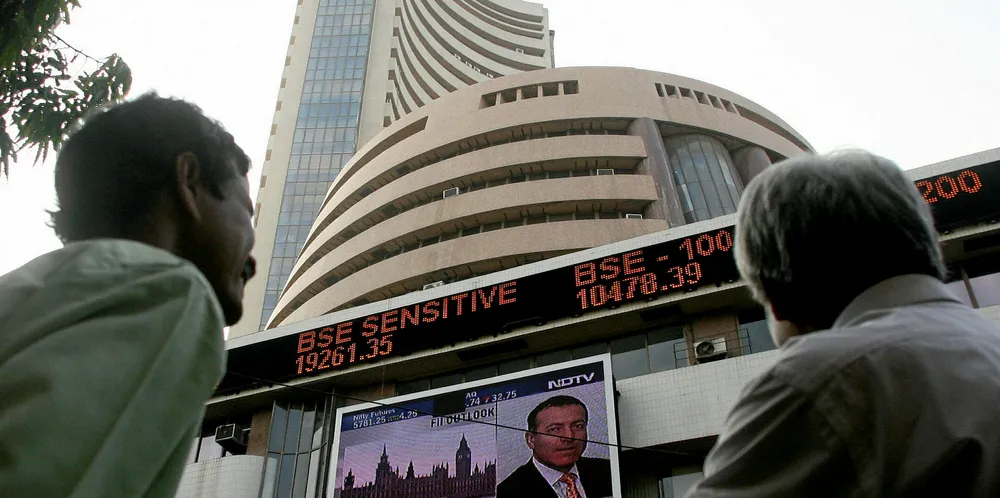 Indian investors watch a stock ticker outside the Bombay Stock Exchange (BSE) in Mumbai.