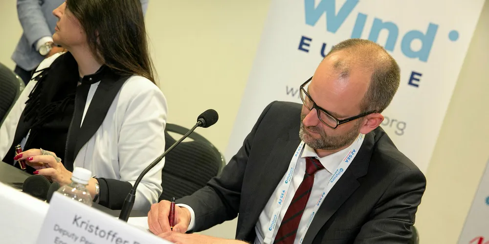 Deputy permanent secretary in the Danish ministry of energy, Kristoffer Böttzauw, signs the declaration. Pic: Ian Howarth