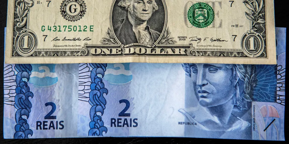 Picture depicting US dollar notes and Brazilian reals. Actis has suffered from a volatile exchange rate.