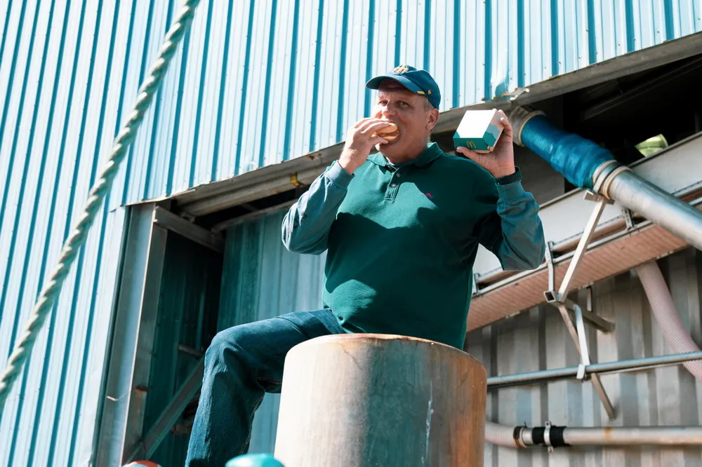 Genuine Alaska Pollock Producers (GAPP) CEO Craig Morris enjoys a McDonald's Filet-o-Fish on a pier in Kodiak, Alaska. Alaska pollock is the main ingredient, and Morris has been on a mission to make sure consumers know that.