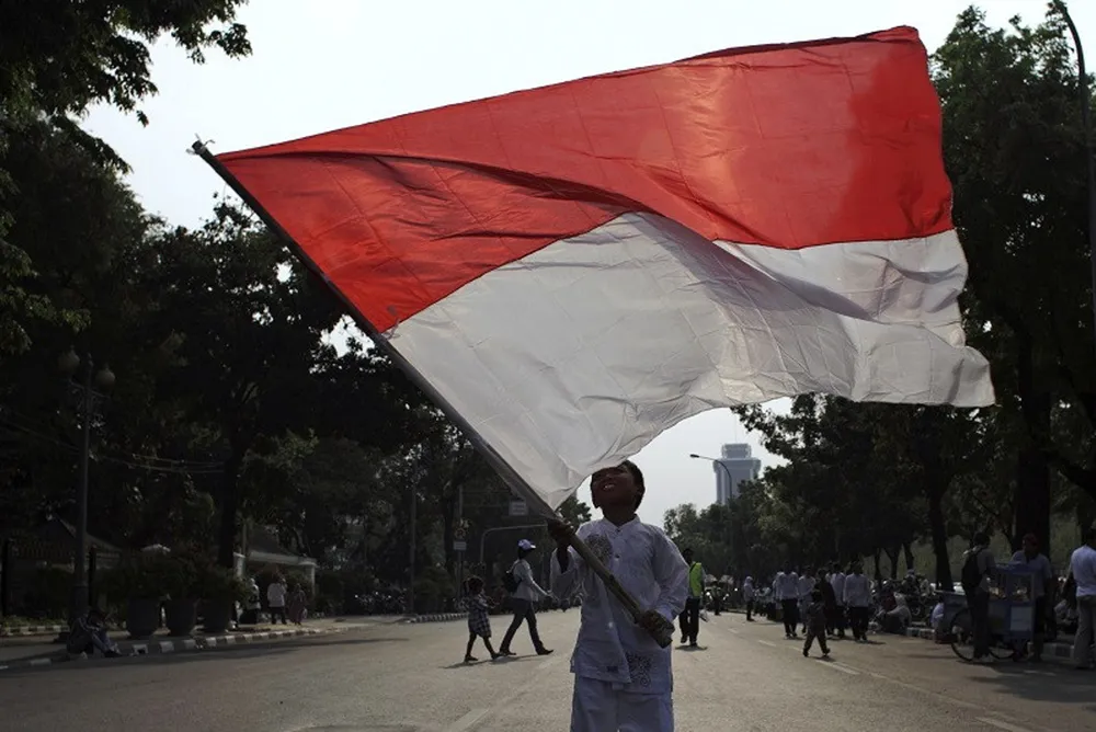 Patriotic: the Indonesian flag being waved in the capital Jakarta