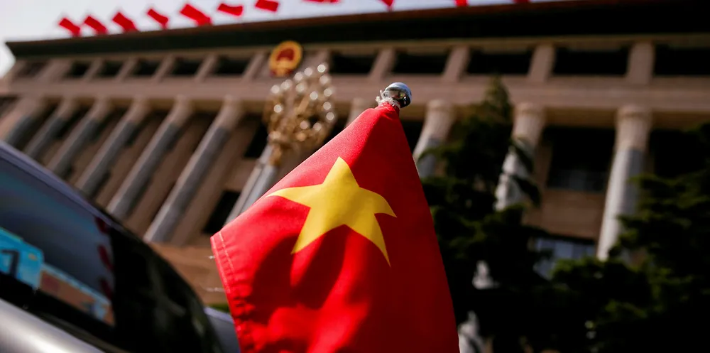 The Vietnamese national flag flies on a diplomatic car outside the Great Hall of the People.