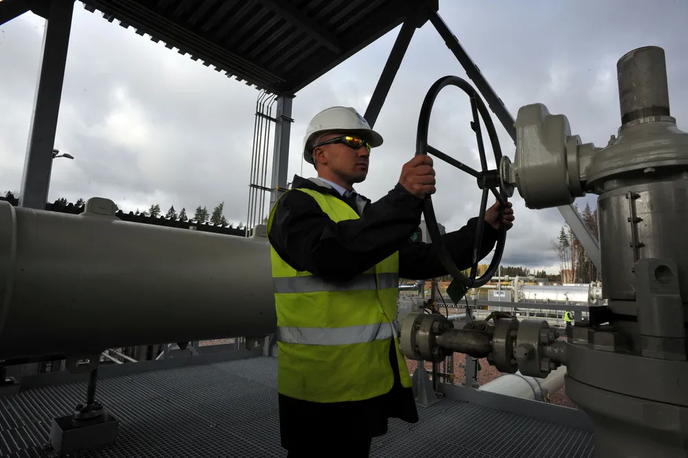 Shifting the balance: an operator feeding natural gas into the offshore segment of the Nord Stream pipeline at the Portovaya compression station, Vybog, north-western Russia,