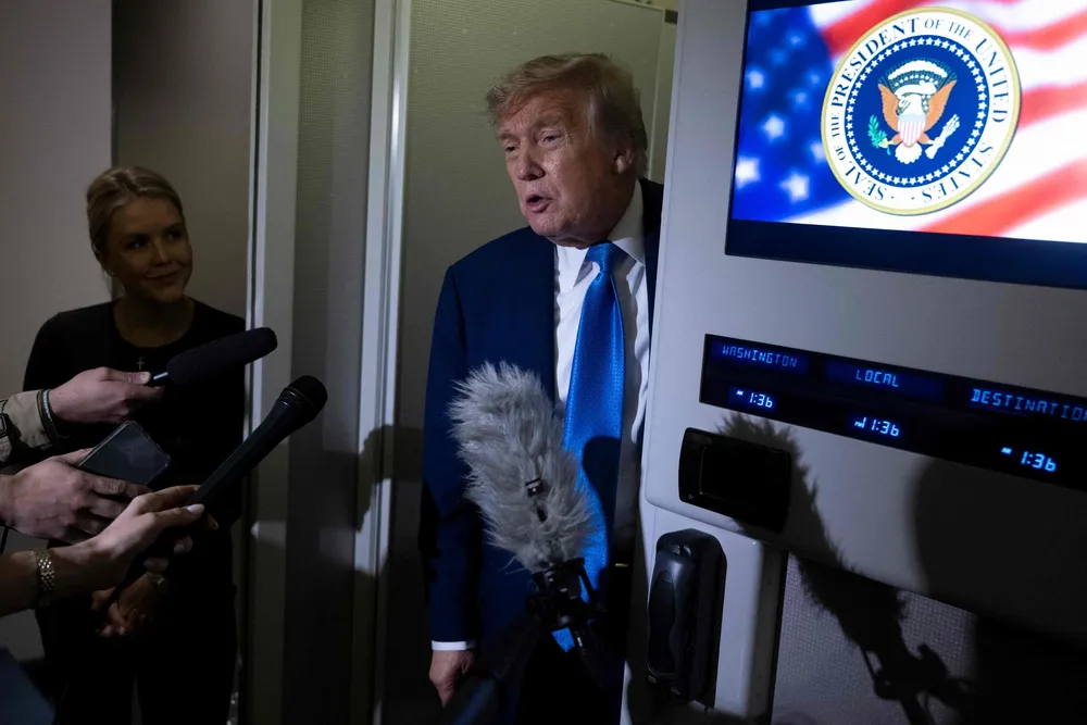 US President Donald Trump speaks to reporters about the G7 Summit aboard Air Force One while travelling back to Washington from Canada on Monday, 16 June 2025.