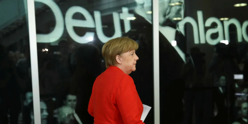 Angela Merkel departs after speaking to the media following two days of talks amongst the CDU leadership at party headquarters on June 18, 2018 in Berlin.