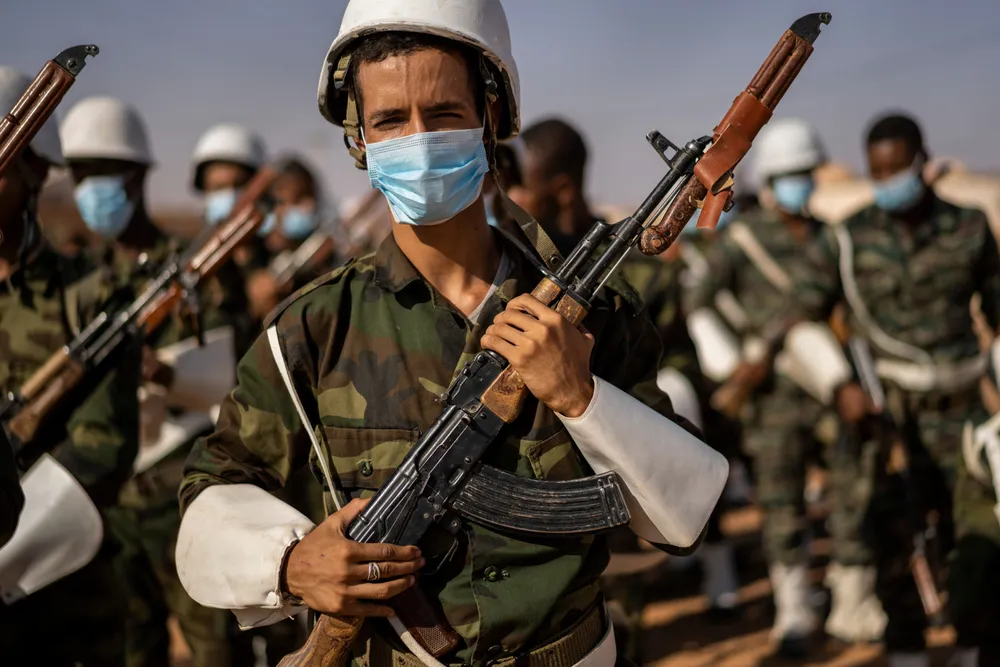 War footing: A Polisario Front soldier holds an AK-47 after a National Unity Day event in the Dajla refugee camp, Algeria last month