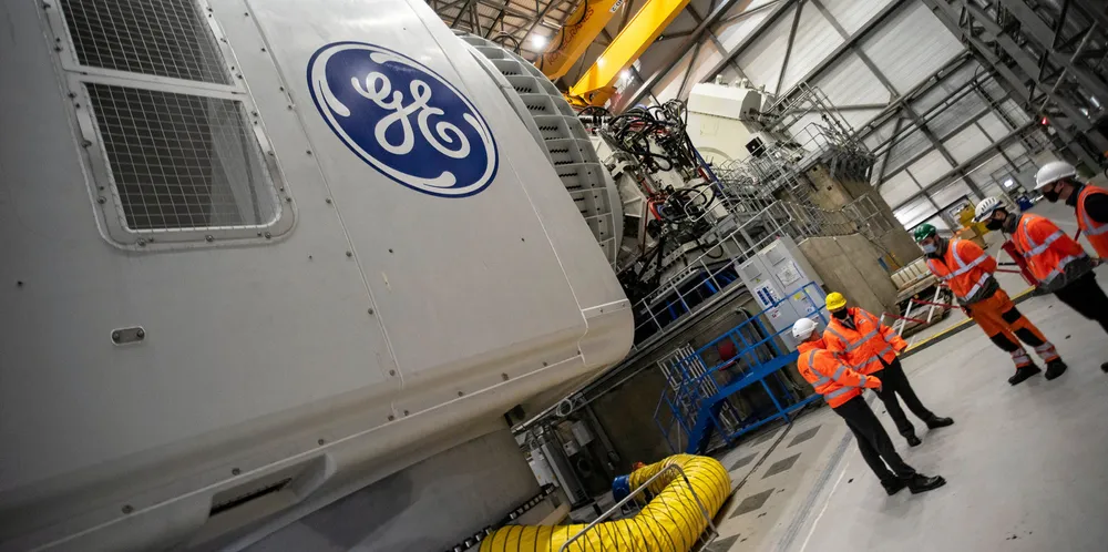 UK Prime Minister Boris Johnson (second from left in yellow hardhat) is shown GE's Haliade-X proto-nacelle undergoing testing at ORE Catapult in Blyth, northeast England