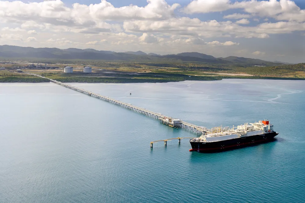 LNG carrier and view of PNG LNG plant, Papua New Guinea.