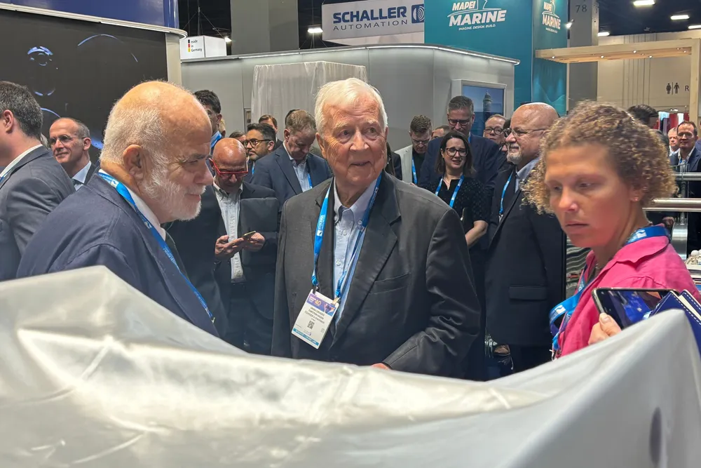Viking Holdings chief executive Torstein Hagen (centre) prepares to unveil a model of his company’s hydrogen-fuelled newbuilding.