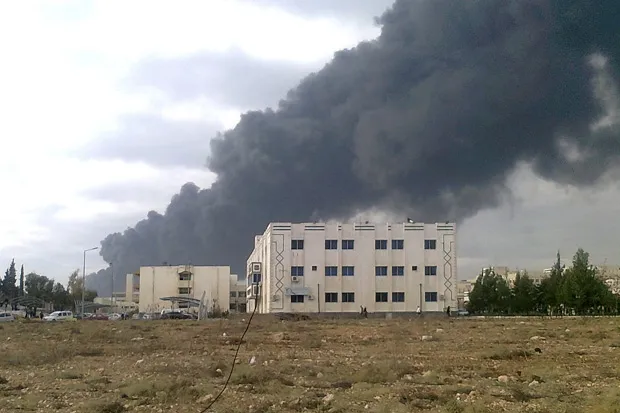 Fallout: smoke rises from the Homs refinery after pipe blast
