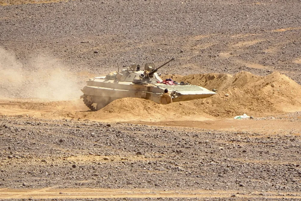 Rising tensions: forces loyal to Yemen's Saudi-backed government get into position during clashes with Huthi rebel fighters in al-Jadaan on 11 February