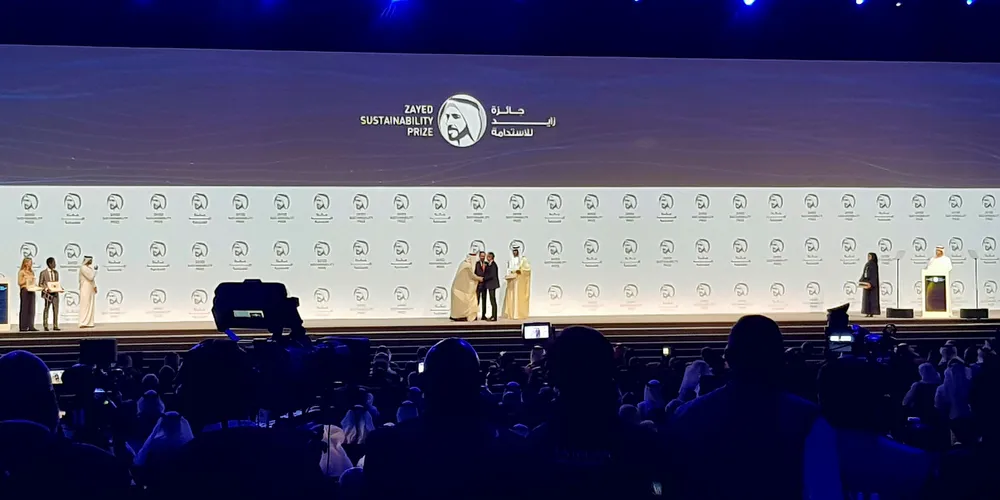 Electricians Without Borders is presented with the Zayed Sustainability Prize by the Crown Prince of Abu Dhabi, Mohammed bin Zayed Al Nahyan.
